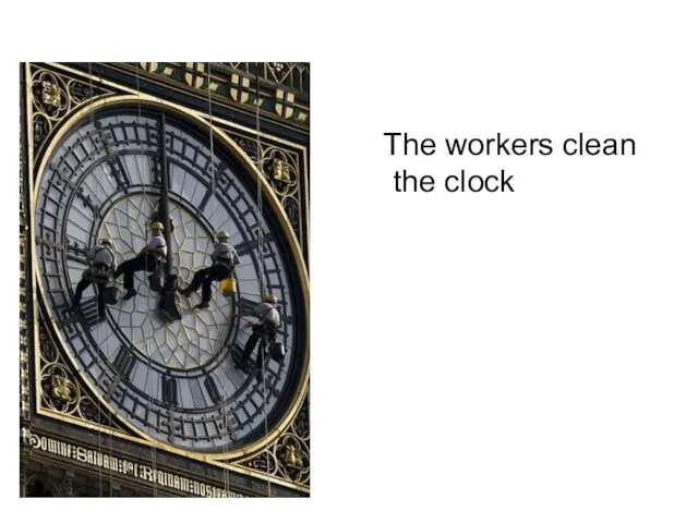 The workers clean the clock