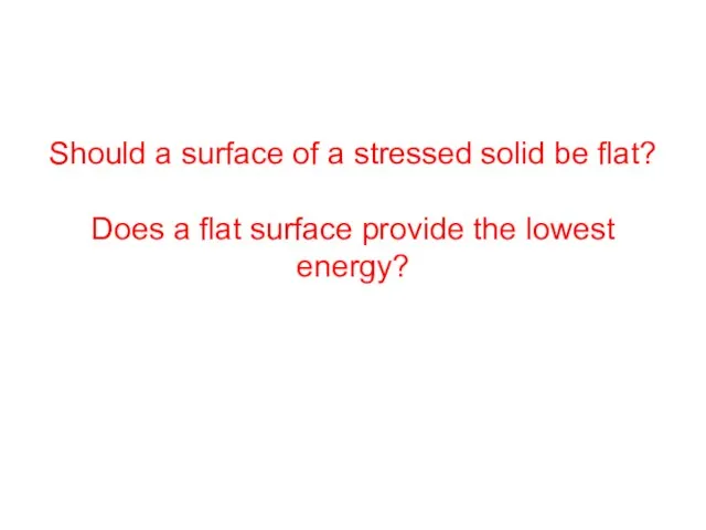 Should a surface of a stressed solid be flat? Does a