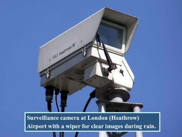 Surveillance camera at London (Heathrow) Airport with a wiper for clear images during rain.