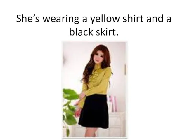 She’s wearing a yellow shirt and a black skirt.