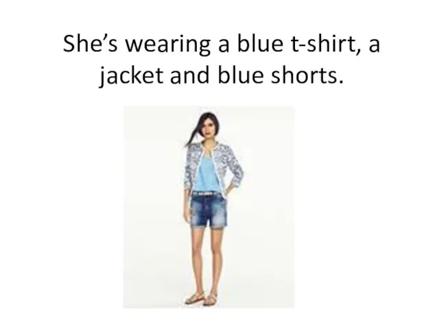 She’s wearing a blue t-shirt, a jacket and blue shorts.