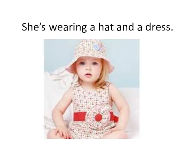 She’s wearing a hat and a dress.