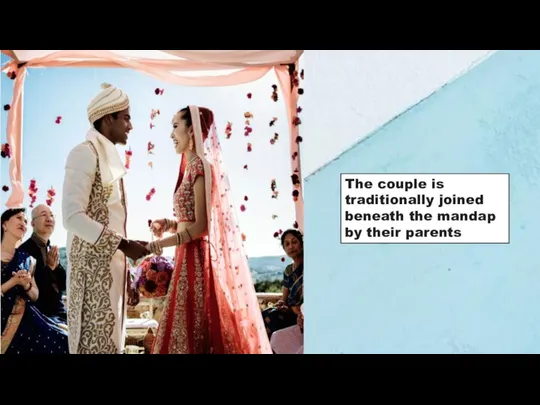 The couple is traditionally joined beneath the mandap by their parents