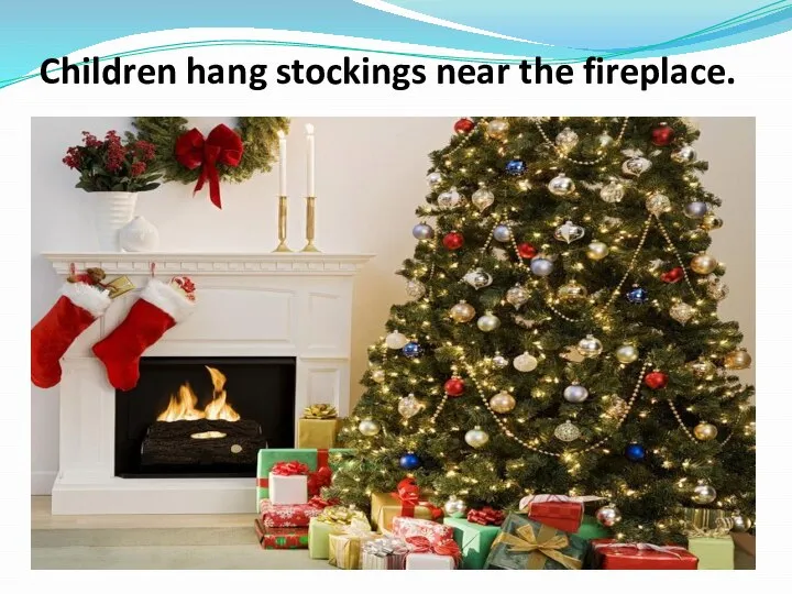 Children hang stockings near the fireplace.